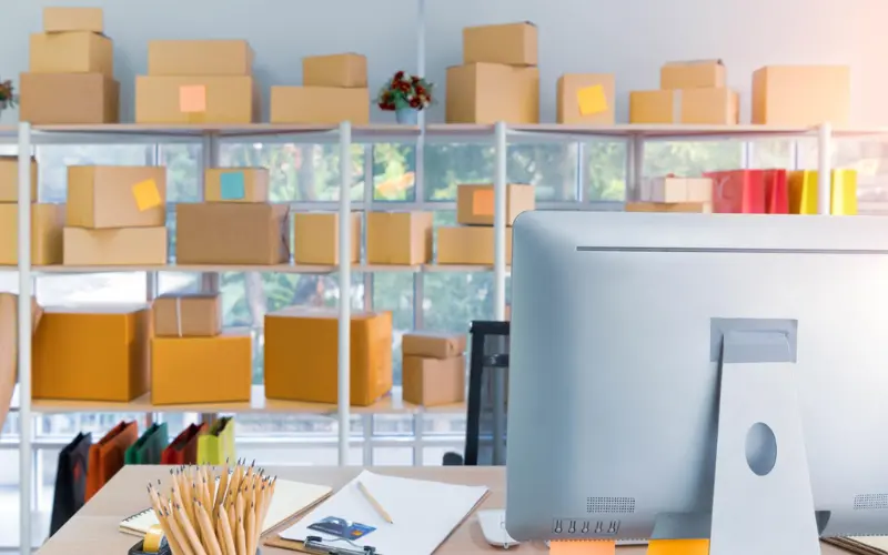 e-commerce business workspace with packaging boxes and inventory for online store management