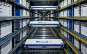Automated Walmart warehouse robots moving inventory through a high-tech AI-powered fulfillment and logistics system.